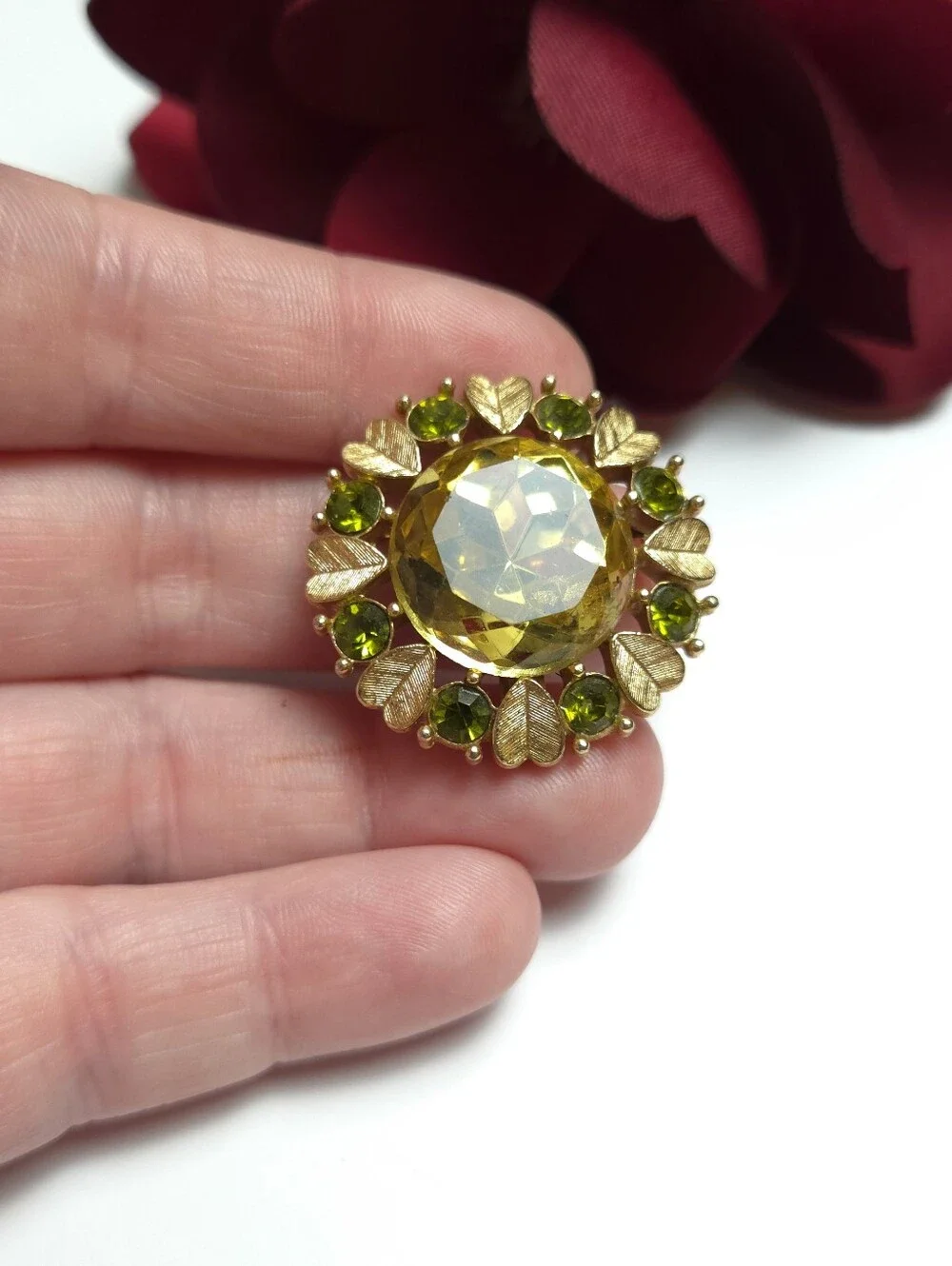Vintage Avon 'Sun Brilliance' Green Crystal Gold Tone Brooch Pendant 1970s Avon